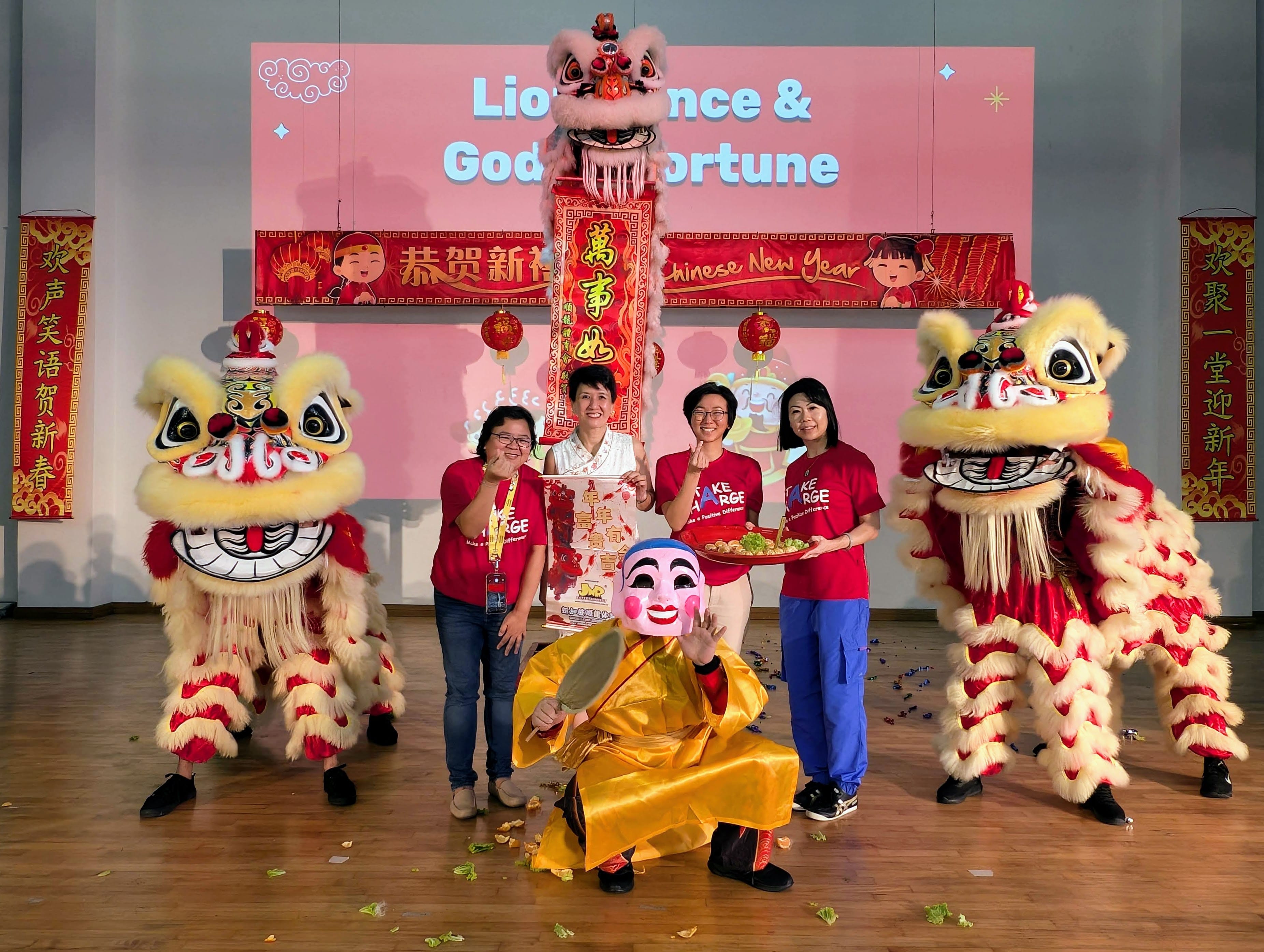 Our school leaders pose with the lion dance troupe